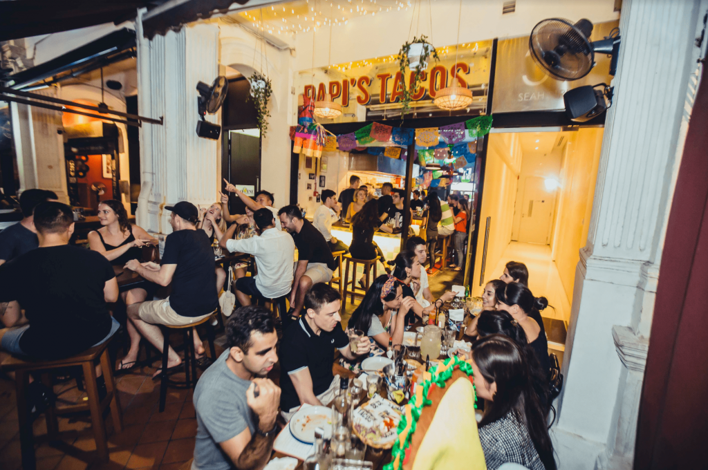People enjoying their time at Papi's Tacos