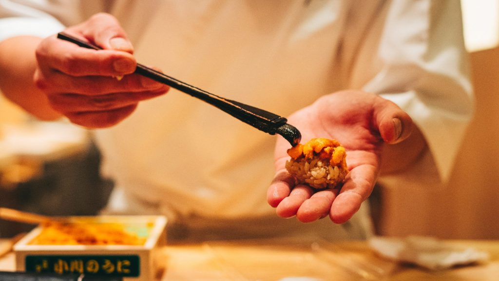 japanese chef serving uni