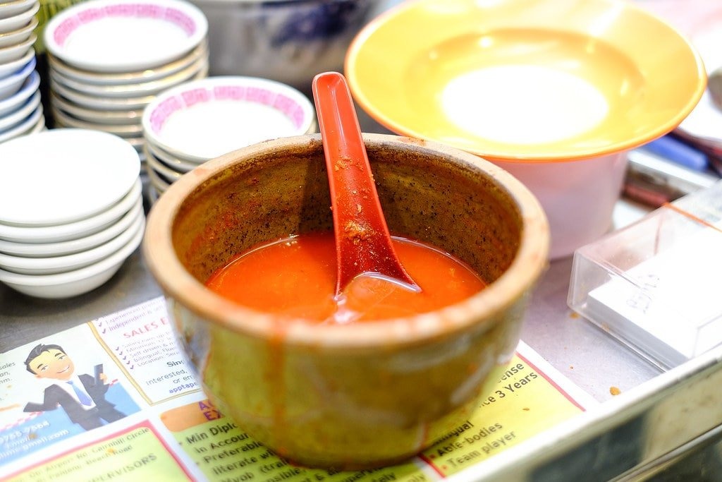 A pot of signature red chili sauce at Lim's Fried Oyster hawker stall