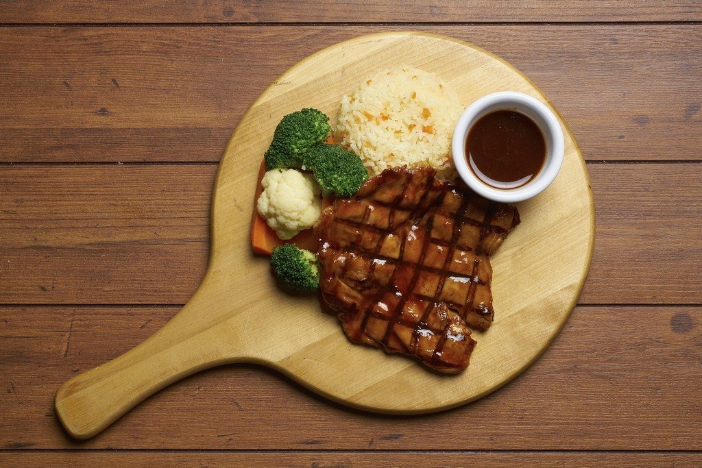 Top-down view of a grilled chicken meal from Buddy Hoagies Steak & Grill Restaurant