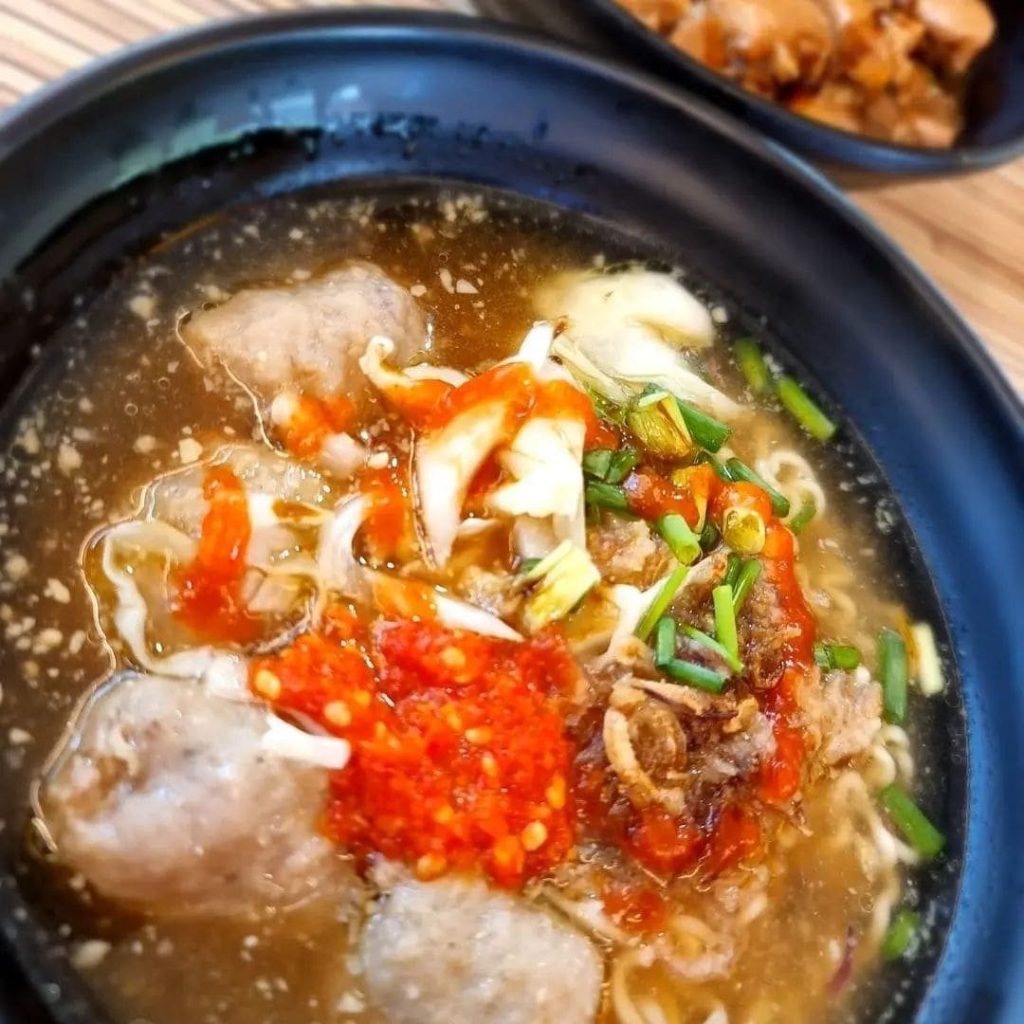 Close-up of a black bowl of Bakso from Makan Empire
