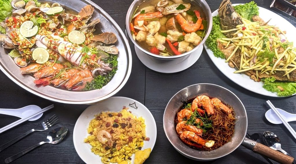 Overhead view of a Thai seafood feast from Nakhon Kitchen